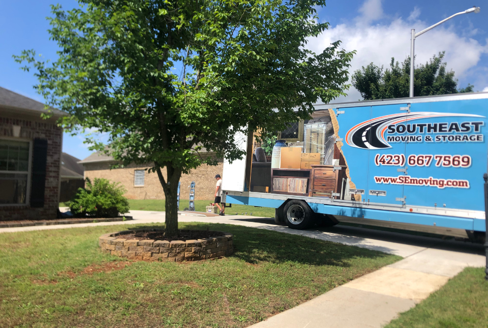 Local Movers Chattanooga truck loaded with furniture and boxes at a residential home in Southeast Tennessee neighborhood
