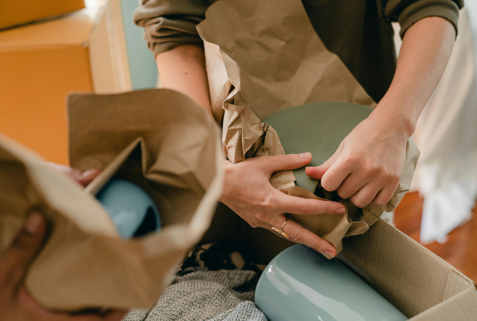 A professional moving specialist providing a binding moving estimate during an in-home walkthrough.